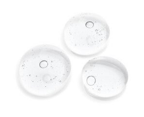 Drops of cosmetic oil on reflective surface