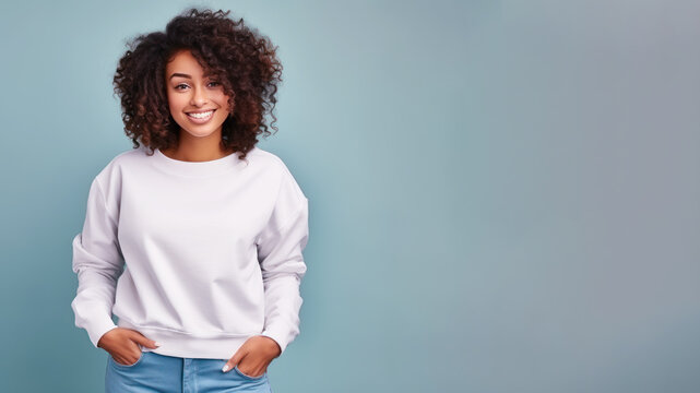 Afro American Woman Wearing White Sweatshirt Isolated On Pastel