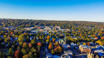 aerial view of a forested town during autumn