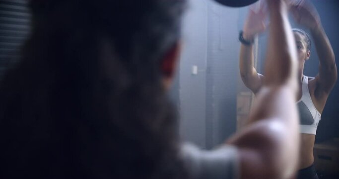 Woman, fitness and team with ball in squats for workout, exercise or indoor training together at gym. Female person, athlete or trainer in teamwork for cardio, muscle gain or glutes at health club