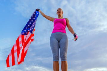 Beautiful US athlete with national flag