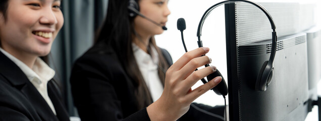 Business people wearing headset working in office to support remote customer or colleague. Call...