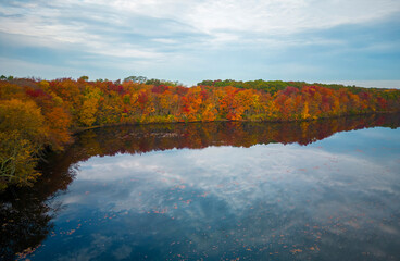 Aerial view of colorful autumn leaves surrounding Southards Pond
