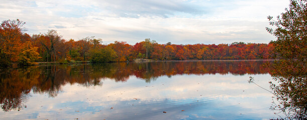 Panorama of Colorful trees surrounding Southards Pond in late October