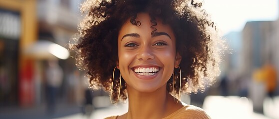 beautiful african american woman with afro hairstyle in city - Powered by Adobe