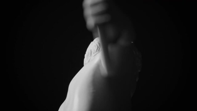 Closeup footage of the upper-back side of the Discobolus (Discus thrower) Greek marble sculpture