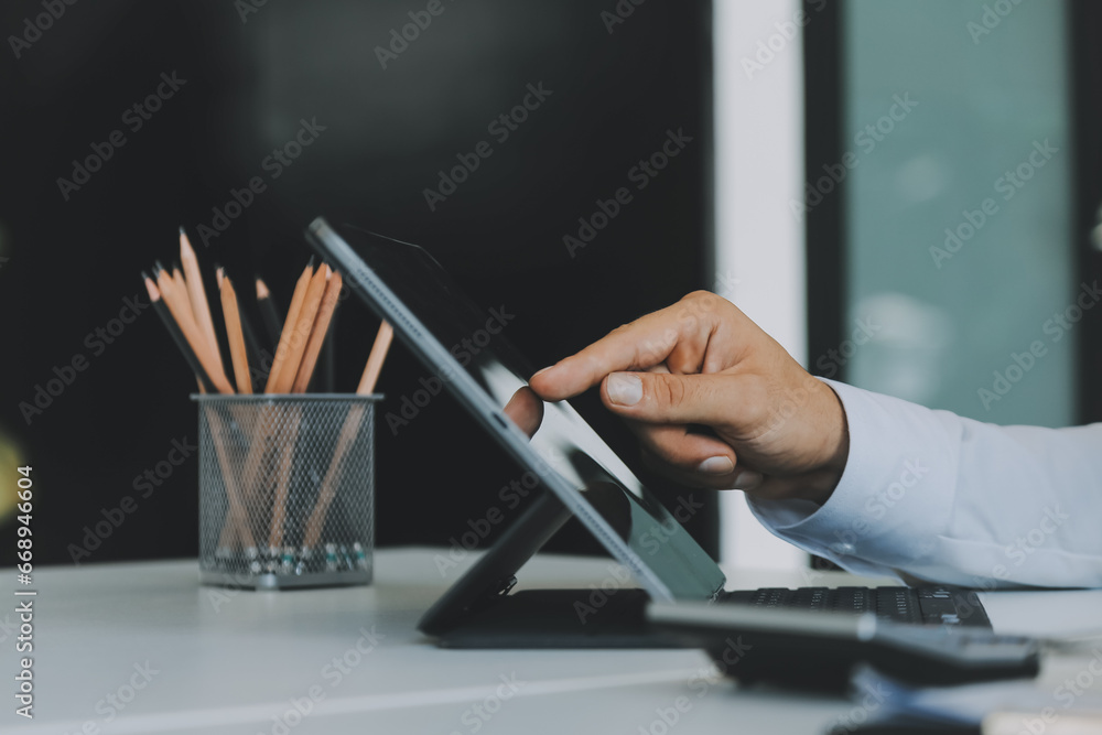 Wall mural close up of business team analyzing income charts and graphs with modern laptop computer. business a