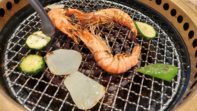 barbecue plate of shramps and Dinner together design for family time and joyful time