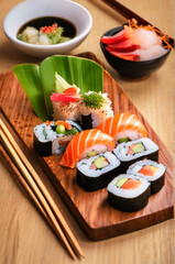 Healthy Japanese cuisine sushi dish with fresh salmon and rice rolls.