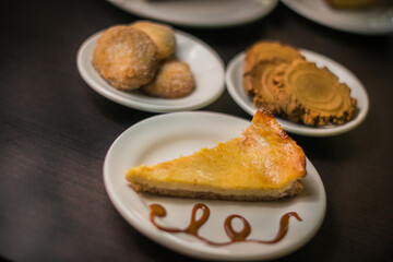 Variety of pieces of cakes and cookies on a table