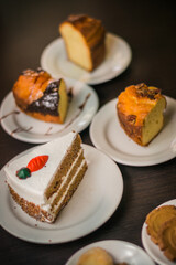Variety of pieces of cakes and cookies on a table