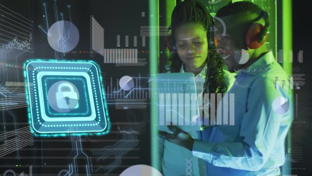 Animation of security padlock over african american male female enginner using laptop at server room