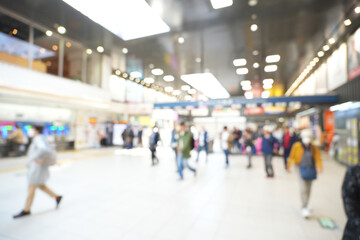 Blurred abstract background of people on subway train platform, travel concept