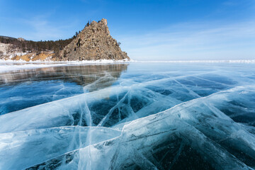 Beautiful winter unusual landscape of frozen Baikal Lake on February sunny day. View from blue ice...