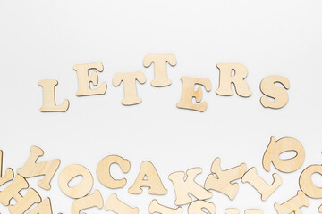 Scattered letters and lettering letters on a white background.
