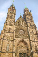 Fototapeta premium Nuremberg, Germany – Saint Lorenz Dome, cathedral, church in historical downtown of the city at sunset colors