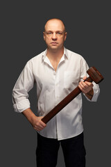 Portrait of a man in a white shirt with a hammer. With clipping path