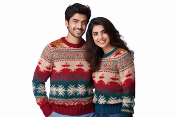 Young couple standing in warm wear on white background.