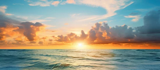 Fototapeten Sun appears over ocean at sunset in Naples Florida © AkuAku