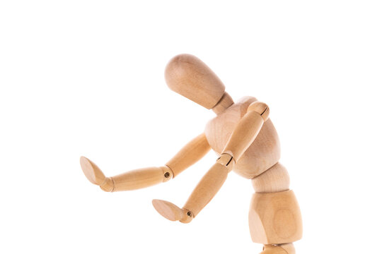 A wooden mannequin is depicted holding a tennis racket. This image can be used to illustrate concepts related to sports, fitness, or even fashion.