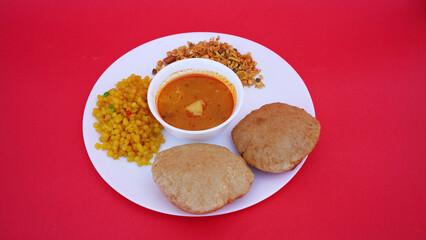 Indian food deep fried Puri Bhaji or Aloo ki Sabji, Potatoes and kheer.