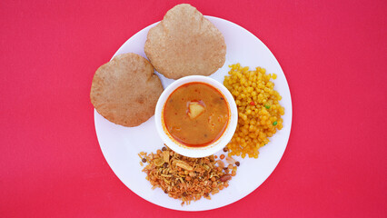 Indian food deep fried Puri Bhaji or Aloo ki Sabji, Potatoes and kheer.