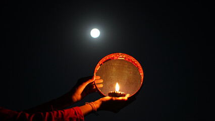 Karwa Chauth strainer and Diya oil lamps for the Karwa Chauth celebration on the night