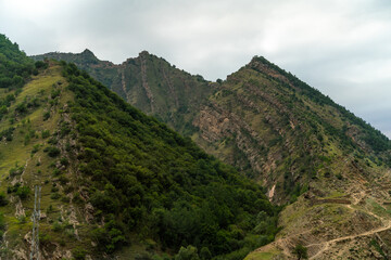 Fototapeta na wymiar Caucasian mountain. Dagestan. Trees, rocks, mountains, view of the green mountains. Beautiful summer landscape.