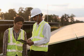 Two engineers discuss maintenance plans for solar cells. Renewable energy with solar generators. Renewable energy concepts for the future world.