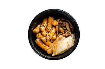 Korean street food Tteokbokki, Topokki fried rice cake stick in spicy sauce. Black background. Top view
