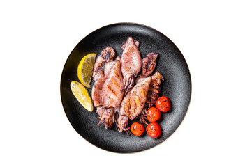 Seafood diner with grilled squid, calamary in a plate. Black background. Top view