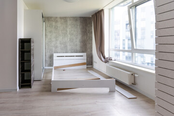 Assembling wooden bed in room - obrazy, fototapety, plakaty