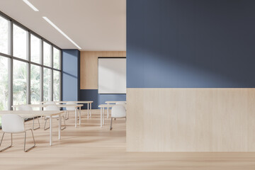 Cozy education room interior with desk and mock up screen, window. Empty wall