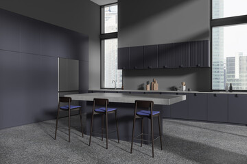 Gray and blue kitchen corner with fridge and island