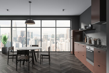 Gray and brown kitchen interior with dining table
