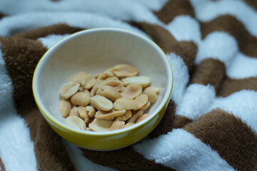 Salted peanuts in the ceramic bow.
