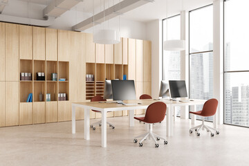 Cozy office interior with pc computers and chairs, shelf and panoramic window