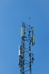 communication tower or 4G 5G network telephone cell site  on blue sky and space for text.