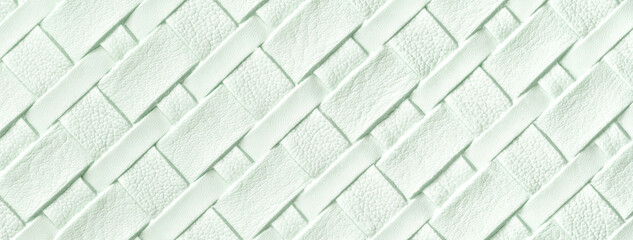 Texture of light green leather background with wicker pattern, macro. Abstract cyan backdrop