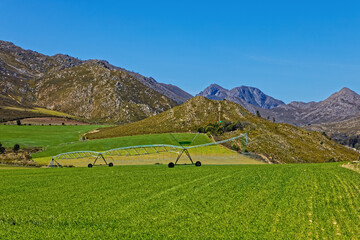Fertile landscape of the remote Langkloof Valley in the Langeberg mountains with a center pivot...