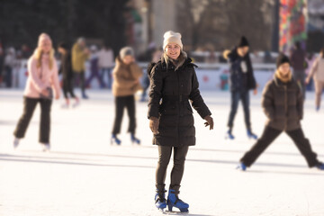 winter lady portrait outside. woman at the skating rink