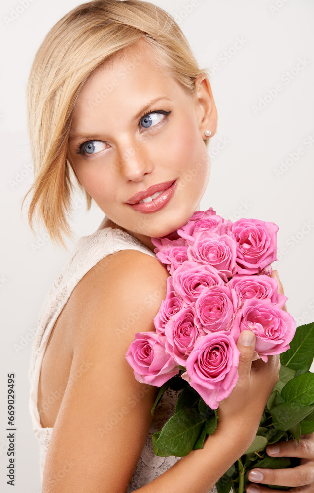 Wall mural Flowers, bouquet and rose with woman in studio for floral, valentines day and romance gift. Plants, beauty and happy with face of female person on white background for elegant, love and present