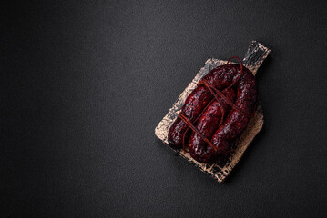 Delicious black blood sausage or black pudding with spices and herbs