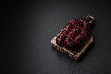 Delicious black blood sausage or black pudding with spices and herbs