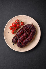 Delicious black blood sausage or black pudding with spices and herbs