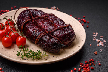 Delicious black blood sausage or black pudding with spices and herbs
