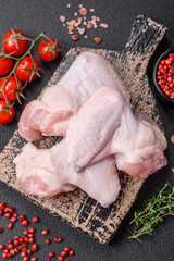 Fresh raw chicken wings with salt and spices prepared for baking