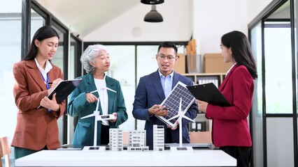 Discussion among businesspeople on the latest developments in solar cell panel technology and Solar Energy Environment city Concept..