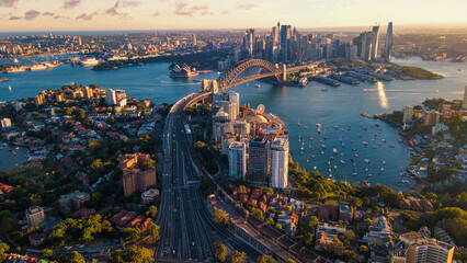 Aerial drone view of Sydney City and Sydney Harbour showing Sydney Harbour Bridge and Lavender Bay in the late afternoon       