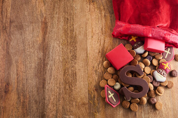 Dutch holiday Sinterklaas background with traditional sweets and chocolate letter.